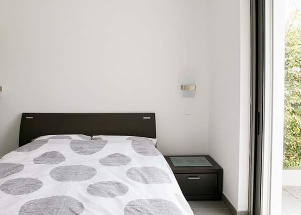 En suite bedroom with patio doors